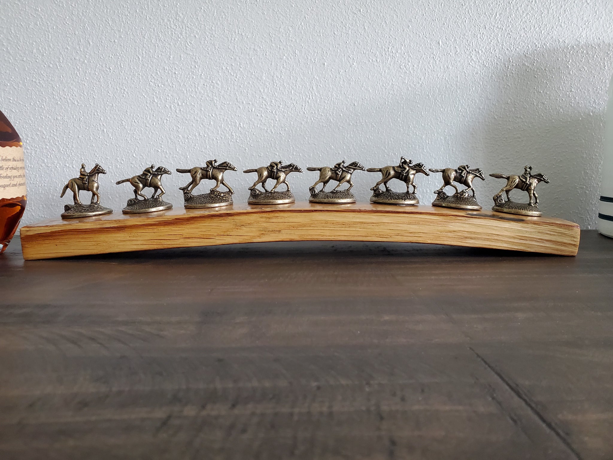 Front view of Blanton's bottle stopper display made from a Buffalo Trace bourbon barrel stave.