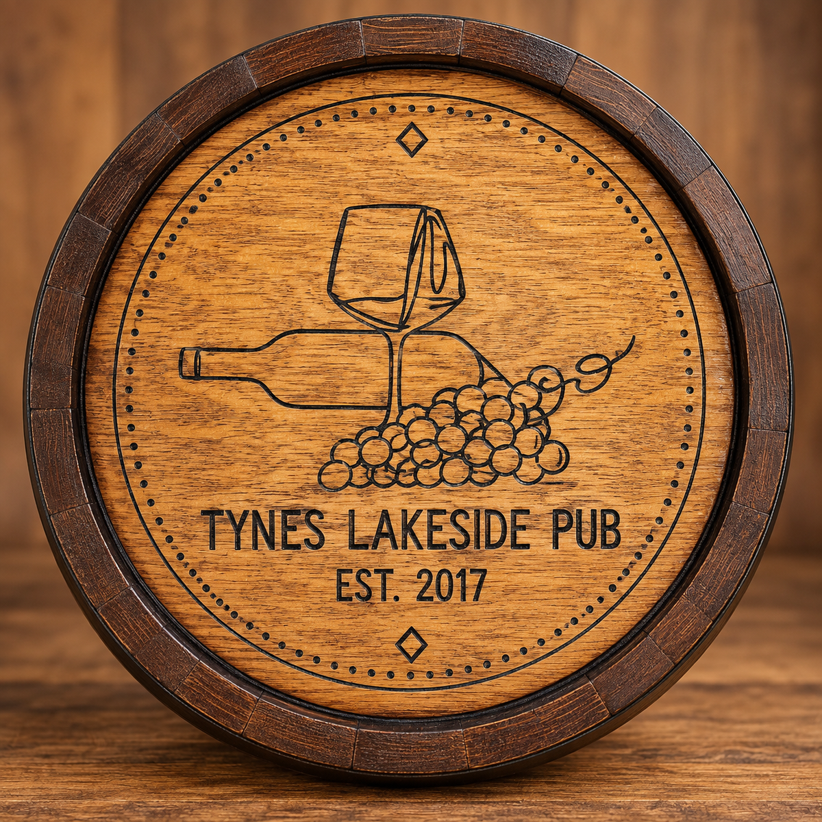 Custom barrel head engraved with Tynes Lakeside Pub lettering, a wine bottle, glass and grapes