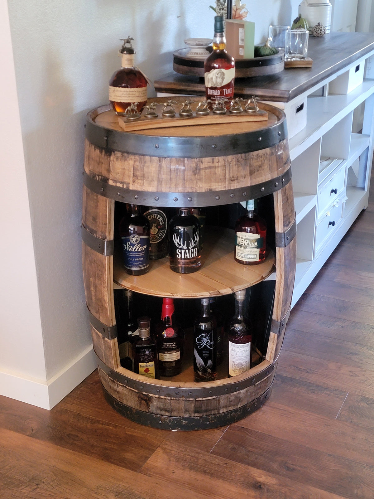 Whiskey barrel cabinet with shelves and bourbon storage in a home