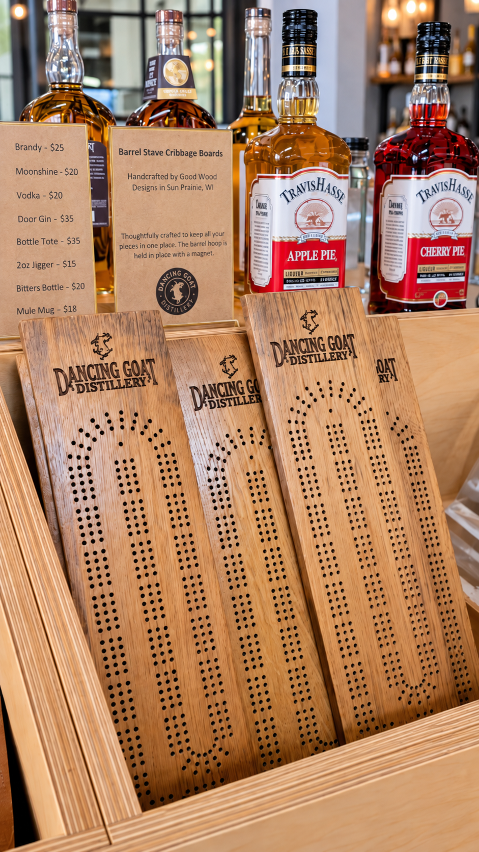 Dancing Goat Distillery custom barrel stave cribbage boards displayed in the distillery