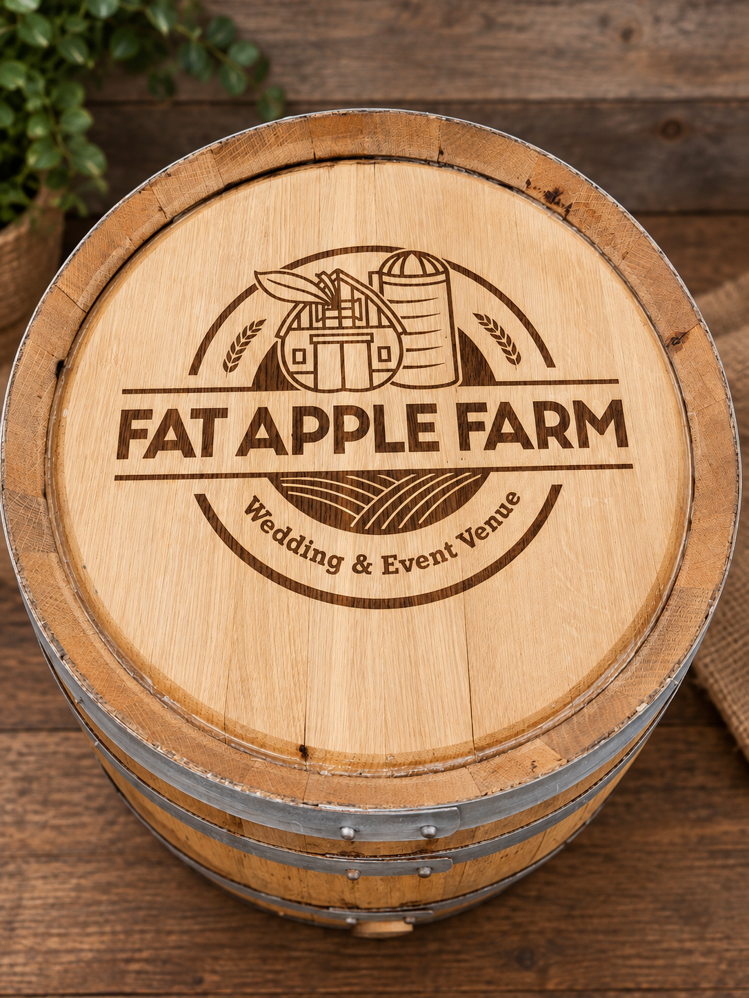 Fat Apple Farm wedding and event venue logo engraved on a custom barrel head