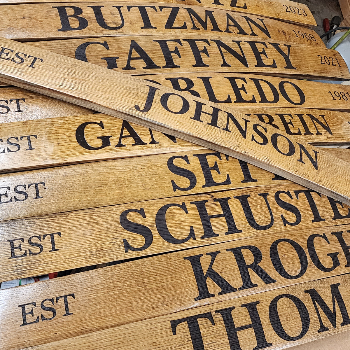 Original engraved wooden name staves showing Goodwood personalization work
