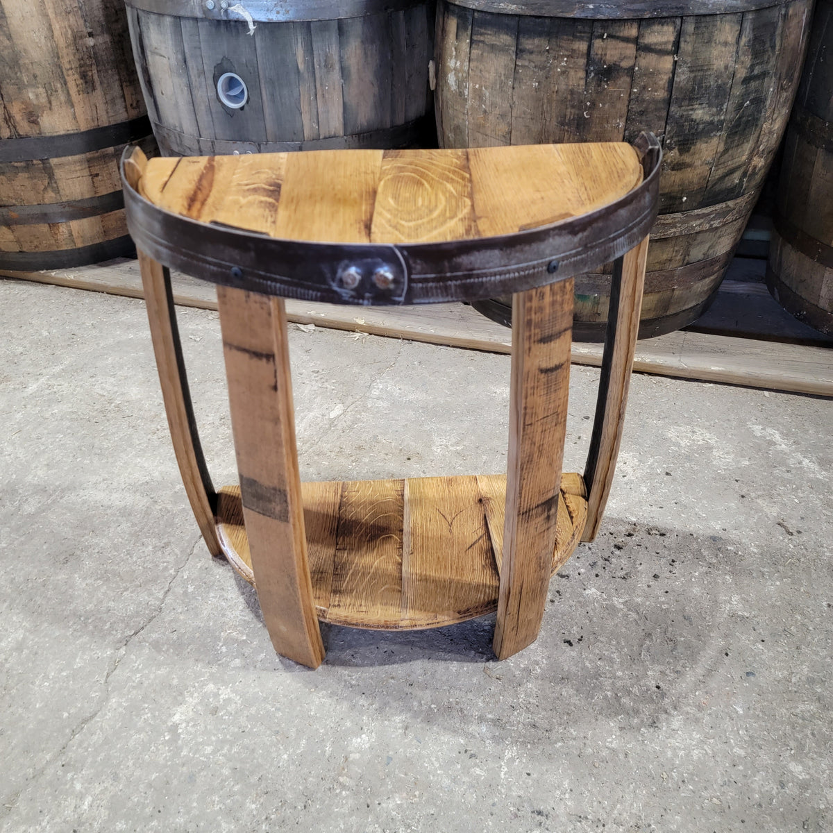 Half barrel-head end table with curved stave legs and a metal barrel hoop